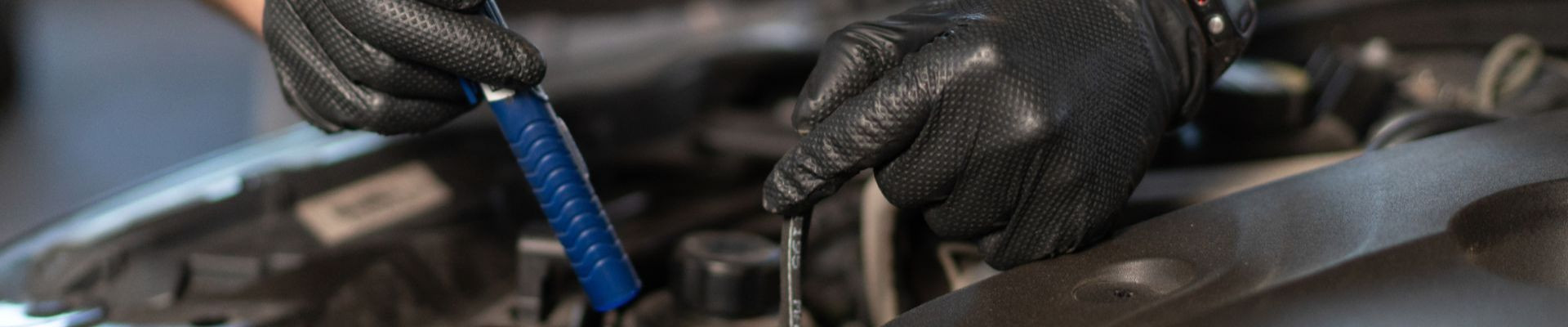 Photo of a Technician repairing a vehicle